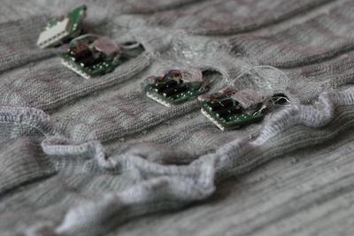 The fabric with conductive yarns to connect the printed circuit boards in a network of sensors and actuators